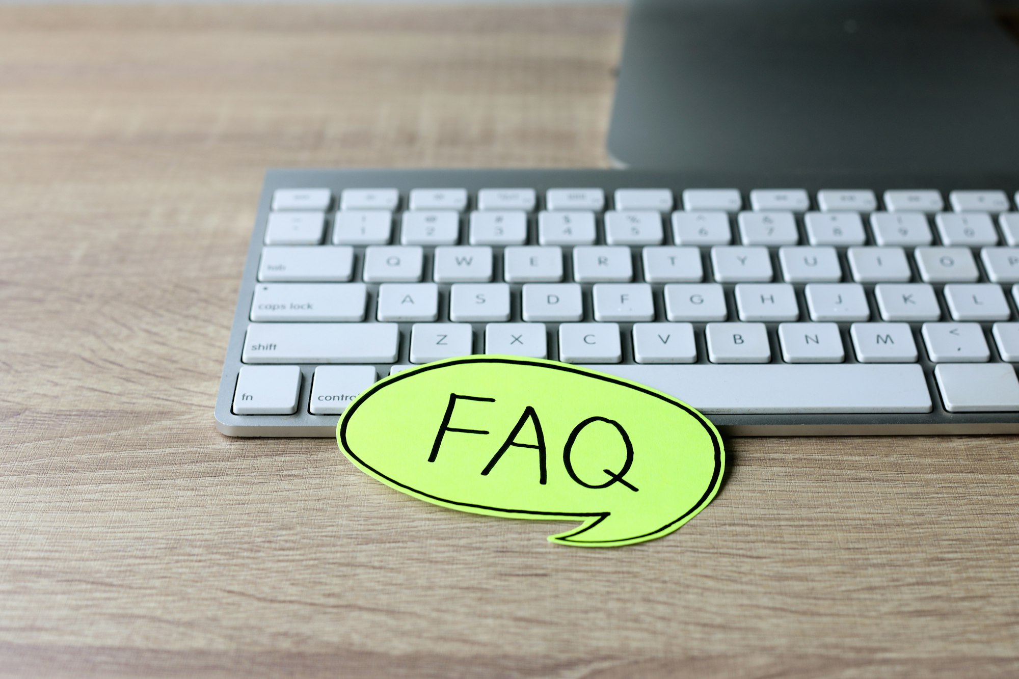 FAQ lettering on office desk.