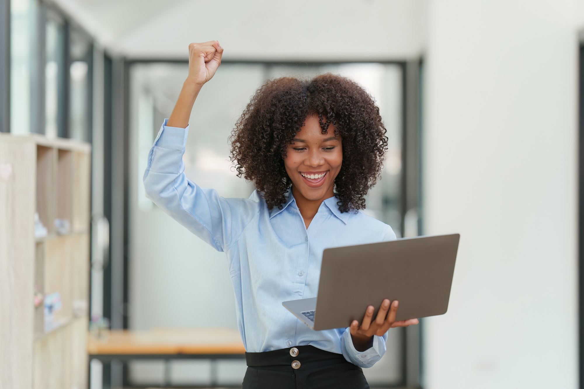 Financial advisor, corporate accountant and african woman in office. analyzing benefits, enjoying