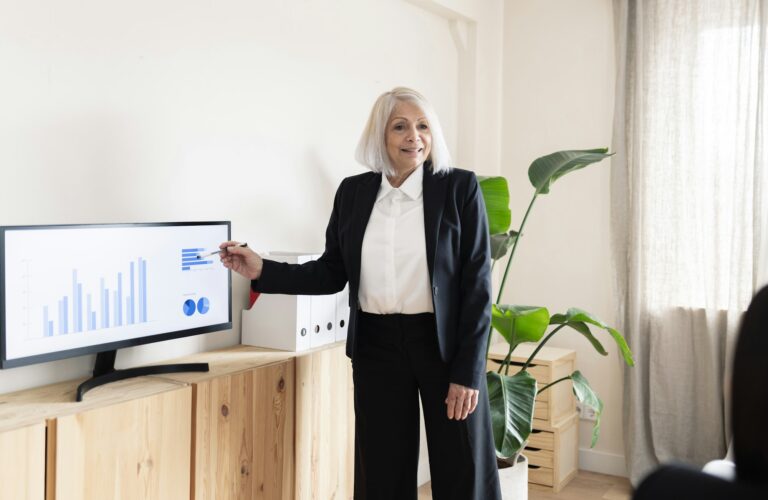 Senior Businesswoman Presenting Corporate Data