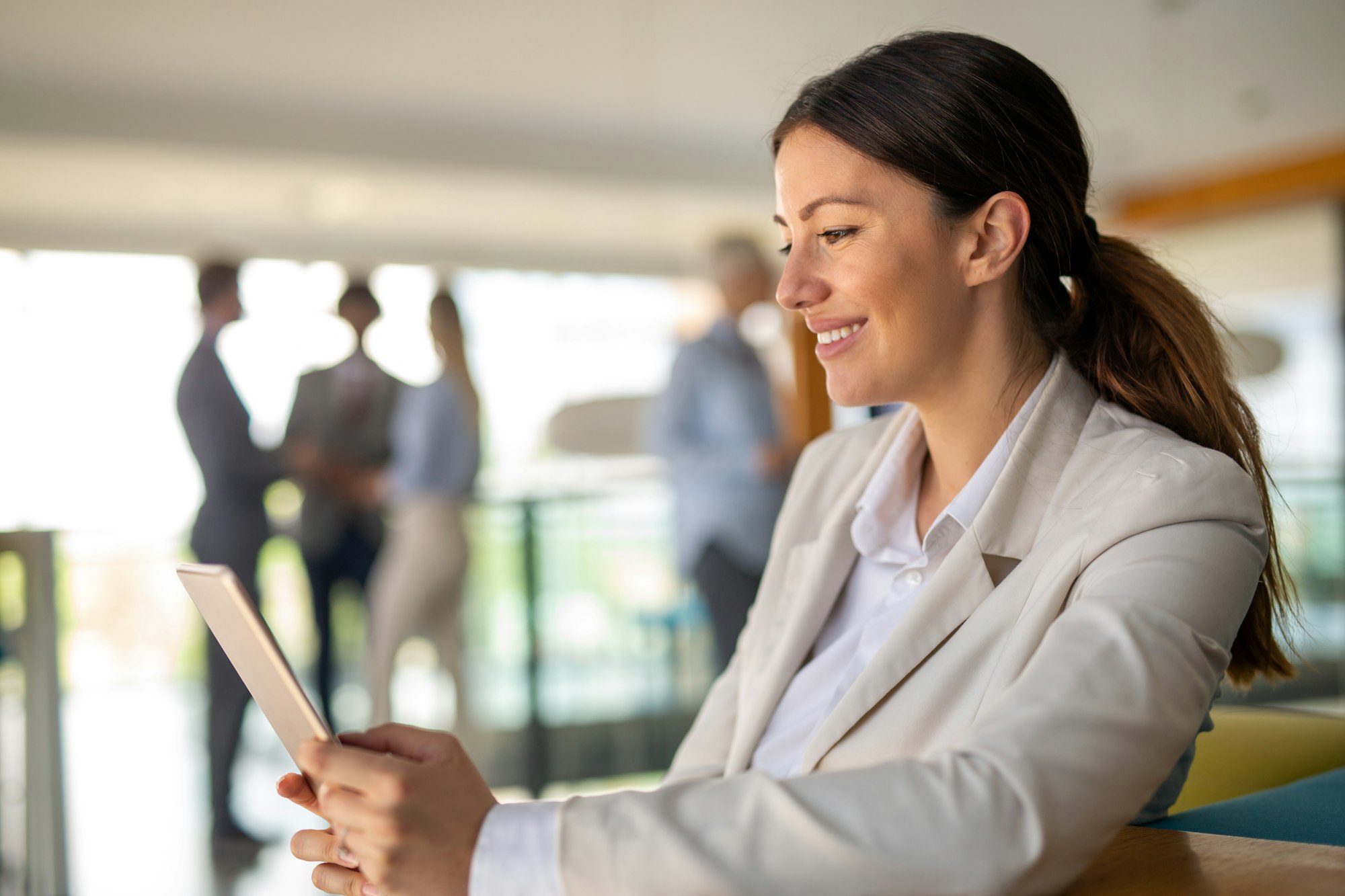 Portrait of a successful business woman using digital tablet in office