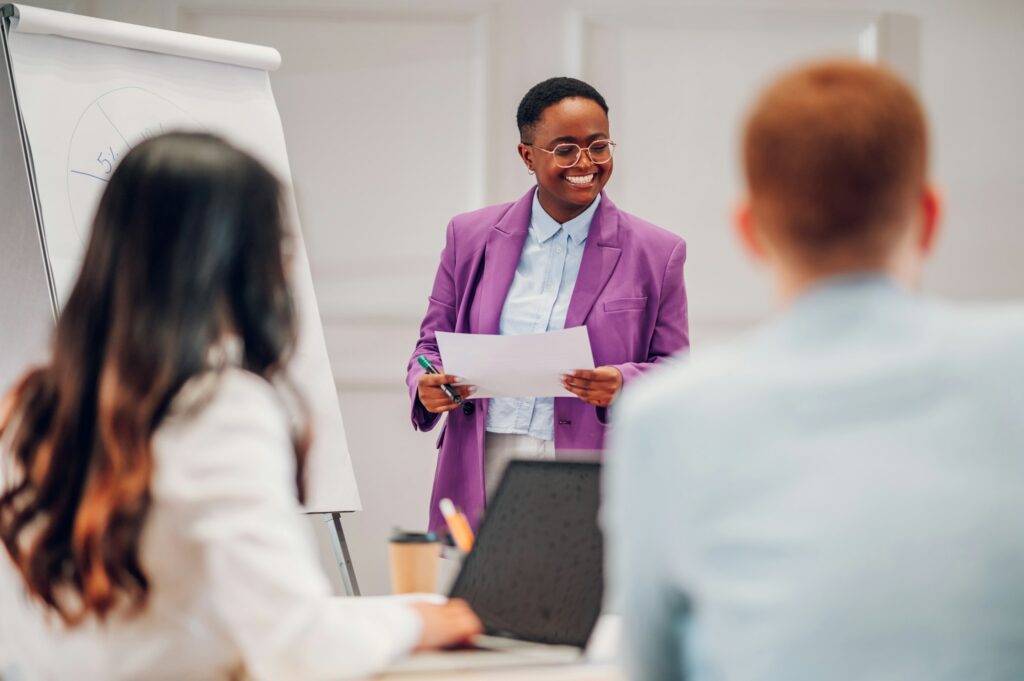 African american businesswoman holding a presentation during a meeting in an office