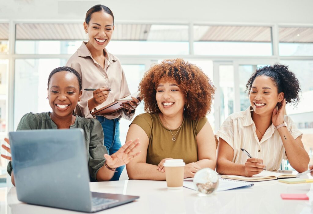 Business women, computer and team planning, collaboration and happy presentation in marketing meeti