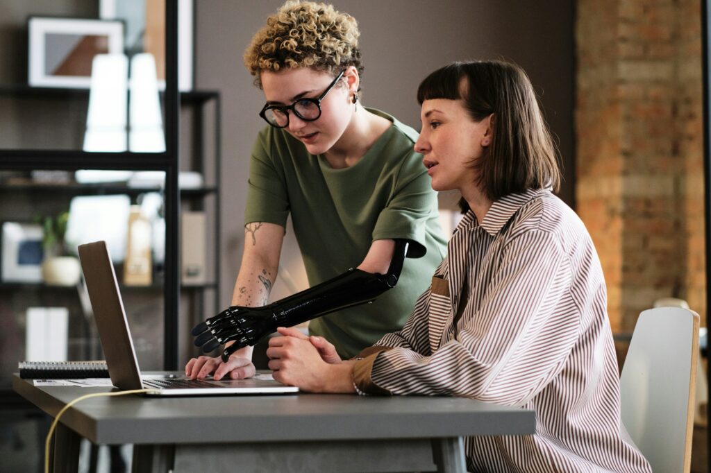 Colleagues discussing online presentation together