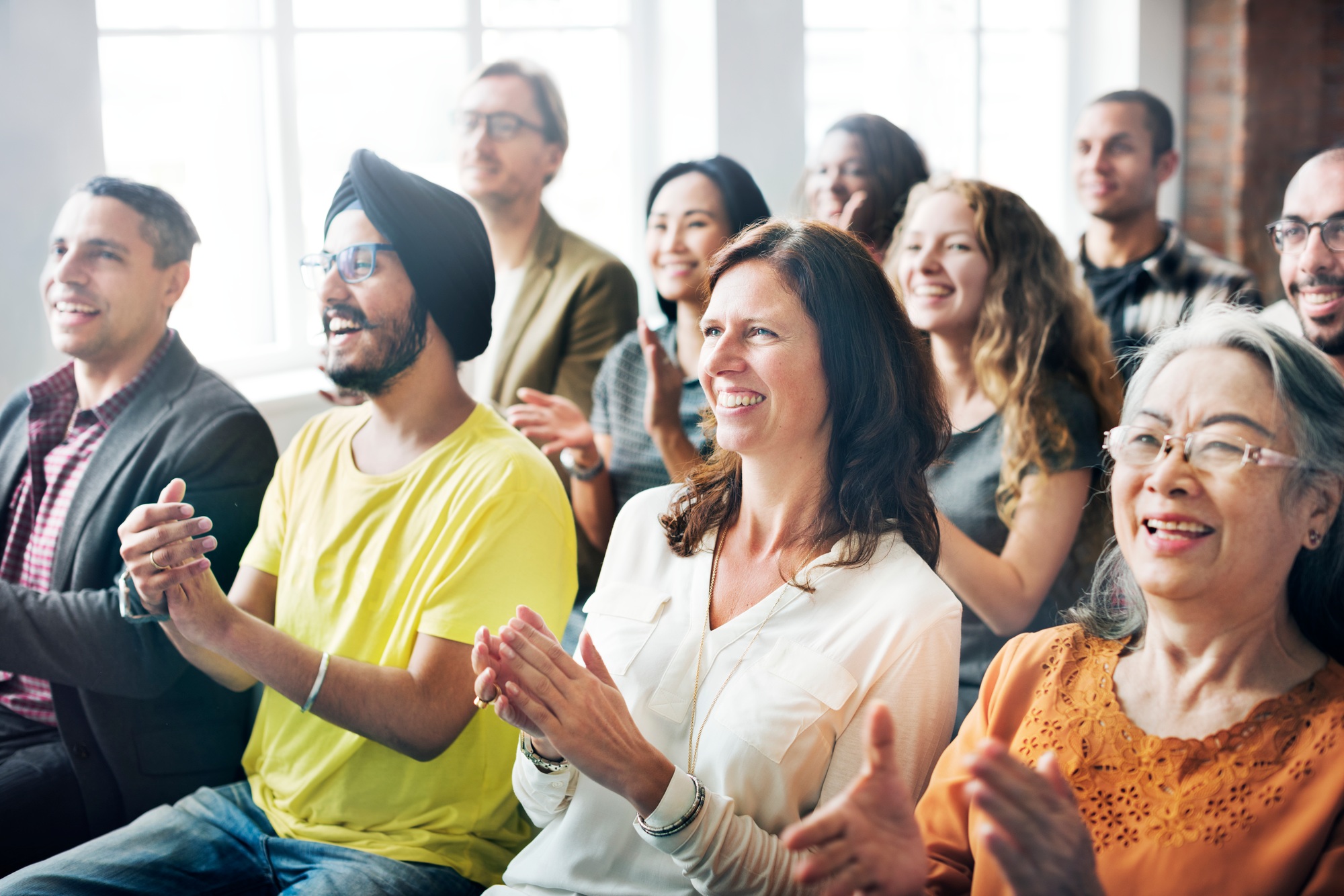 A group of diverse audience in a meeting