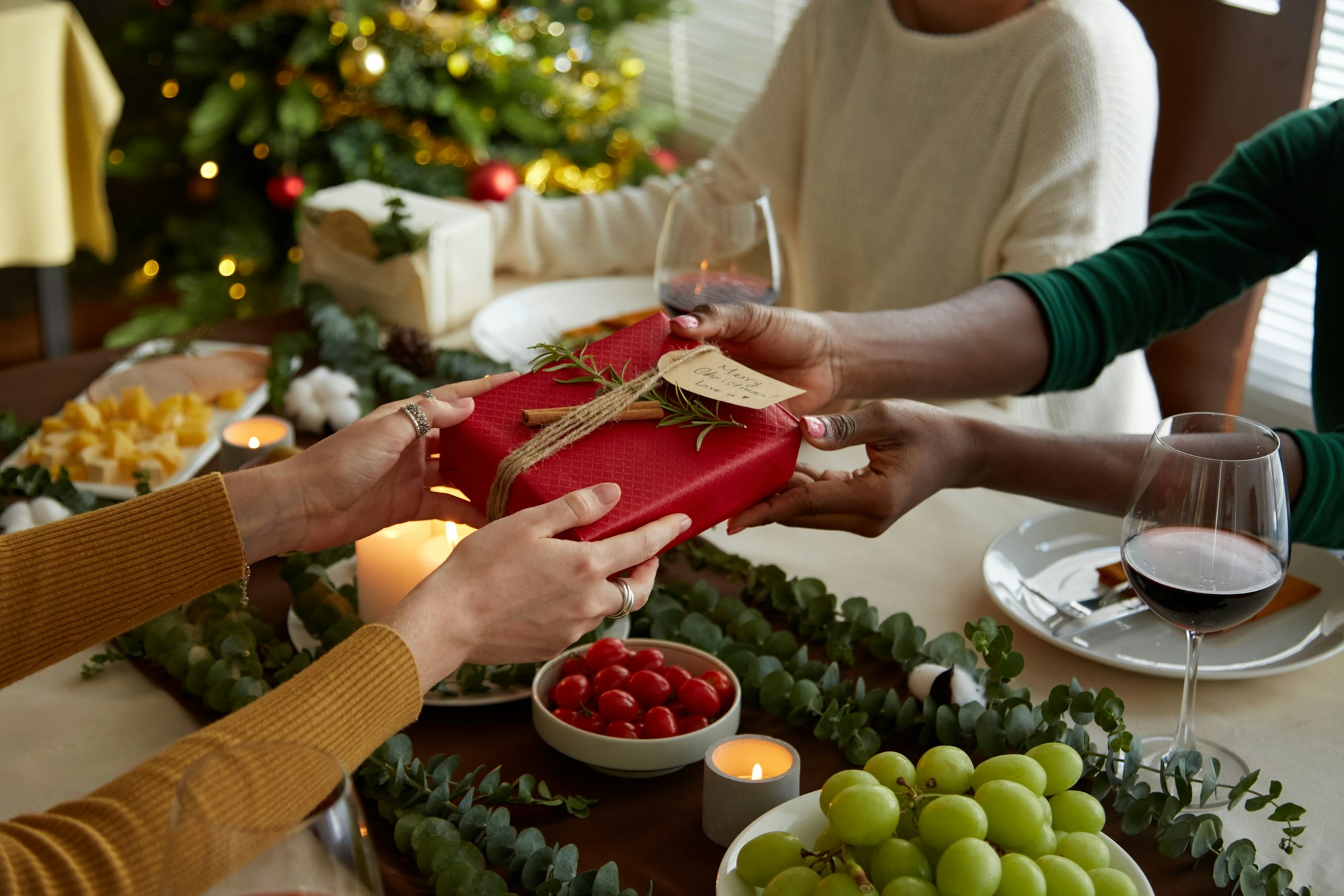 Friends Exchanging Christmas Gifts