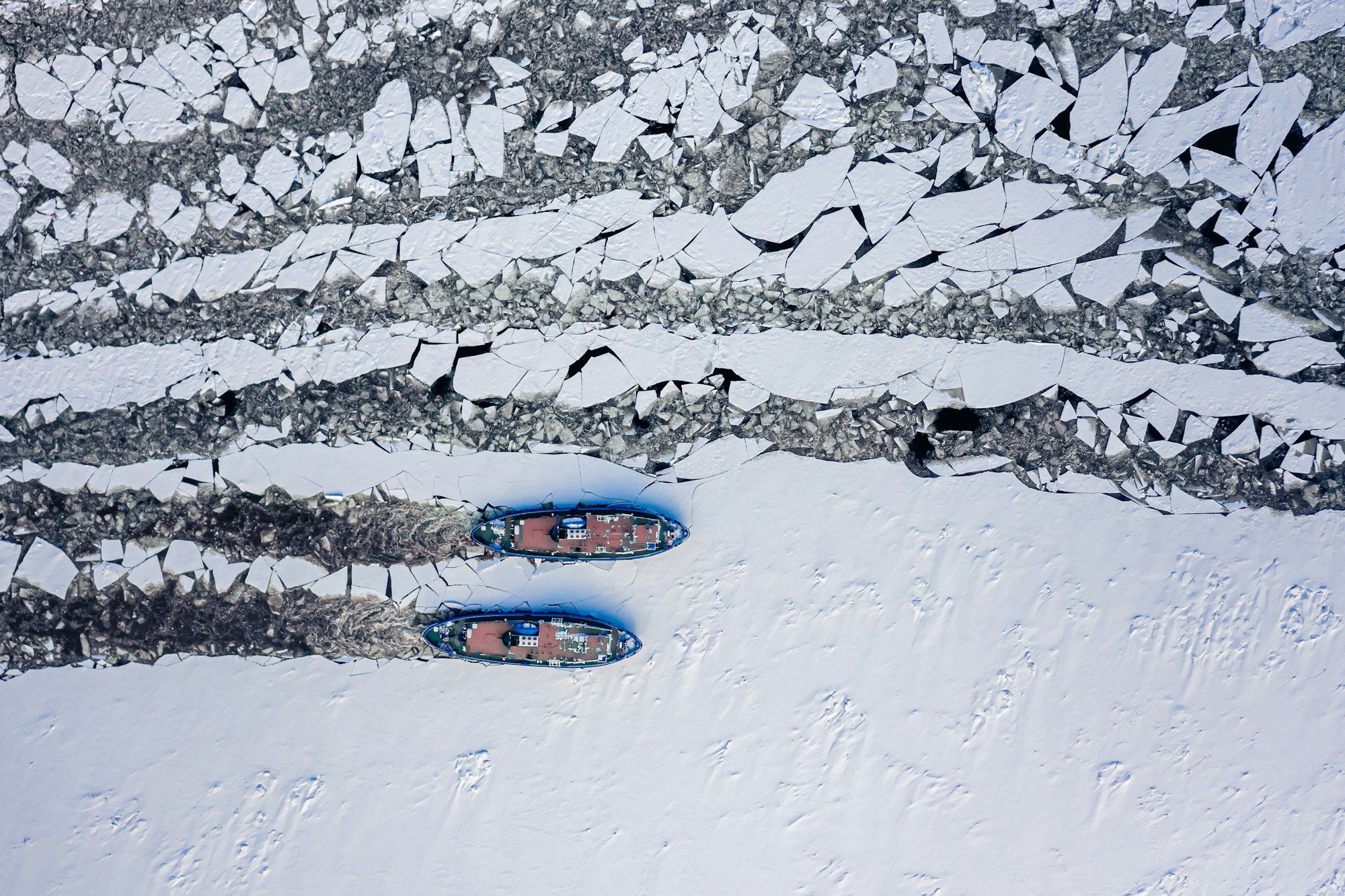 Icebreakers on river breaking the ice in Poland