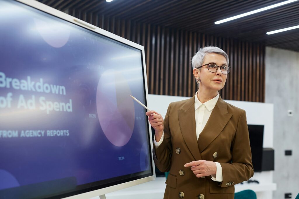 Mature Female Manager Giving Presentation