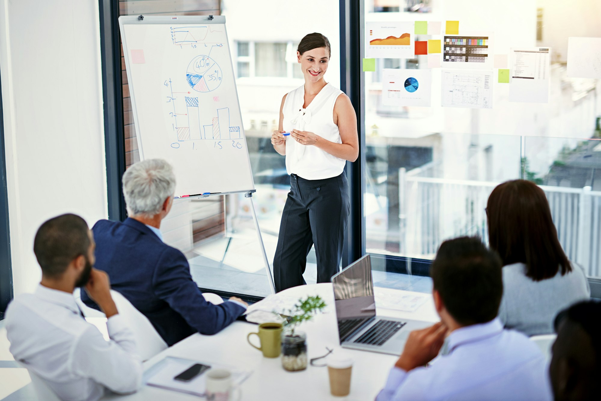 Shot of businesswoman giving a presentation to colleagues in an office