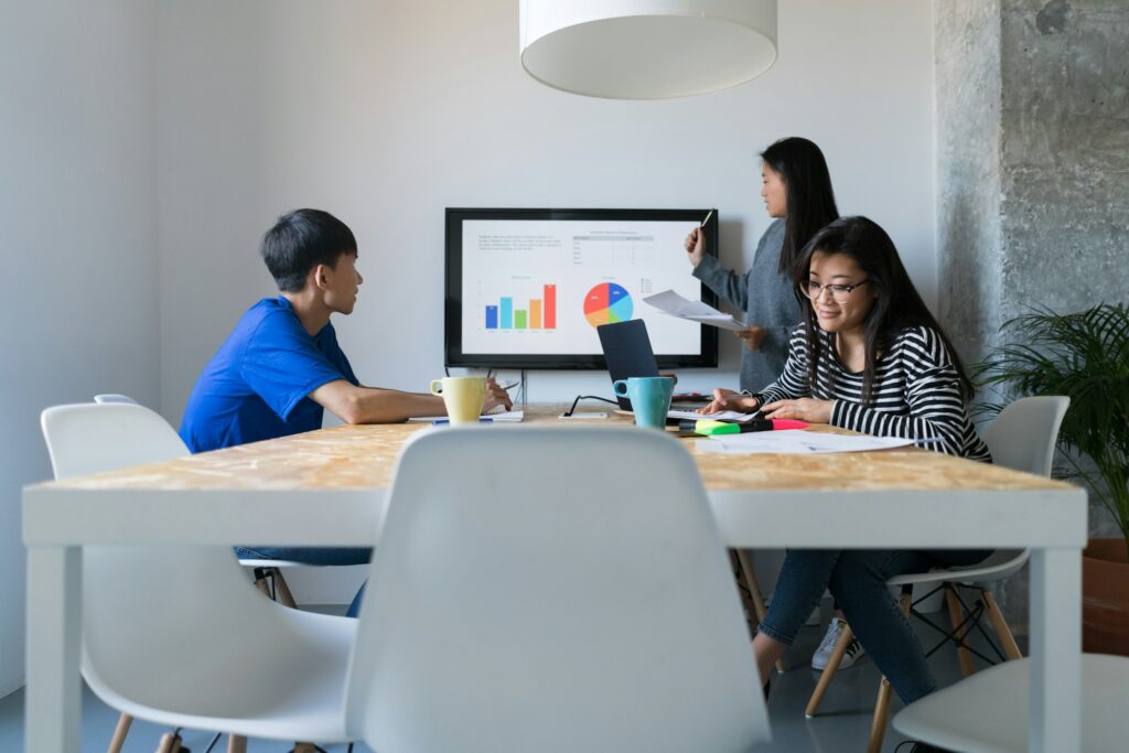 Three co-workers making presentation