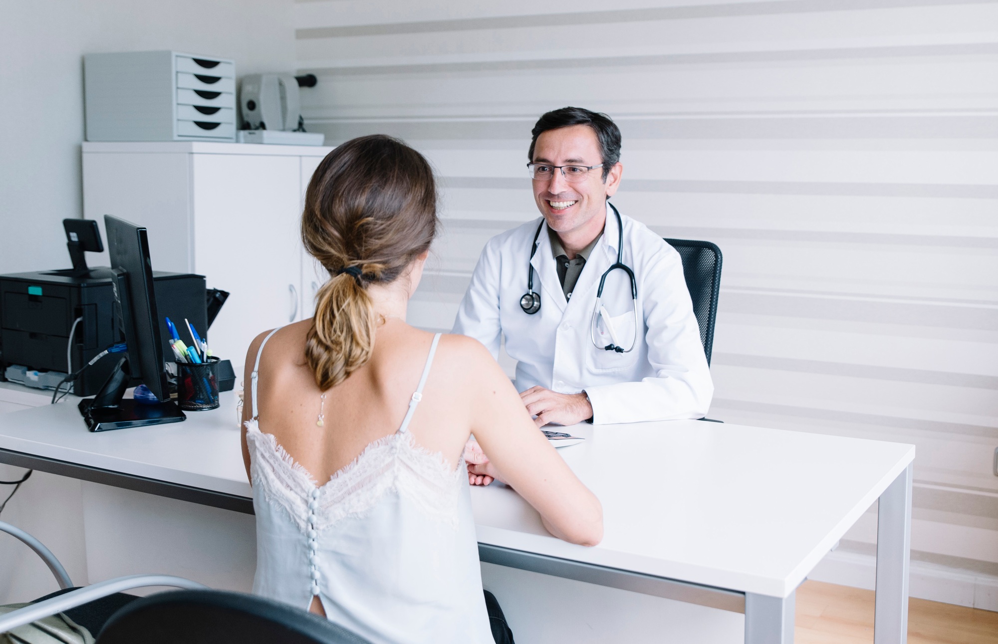 Male doctor with female patient