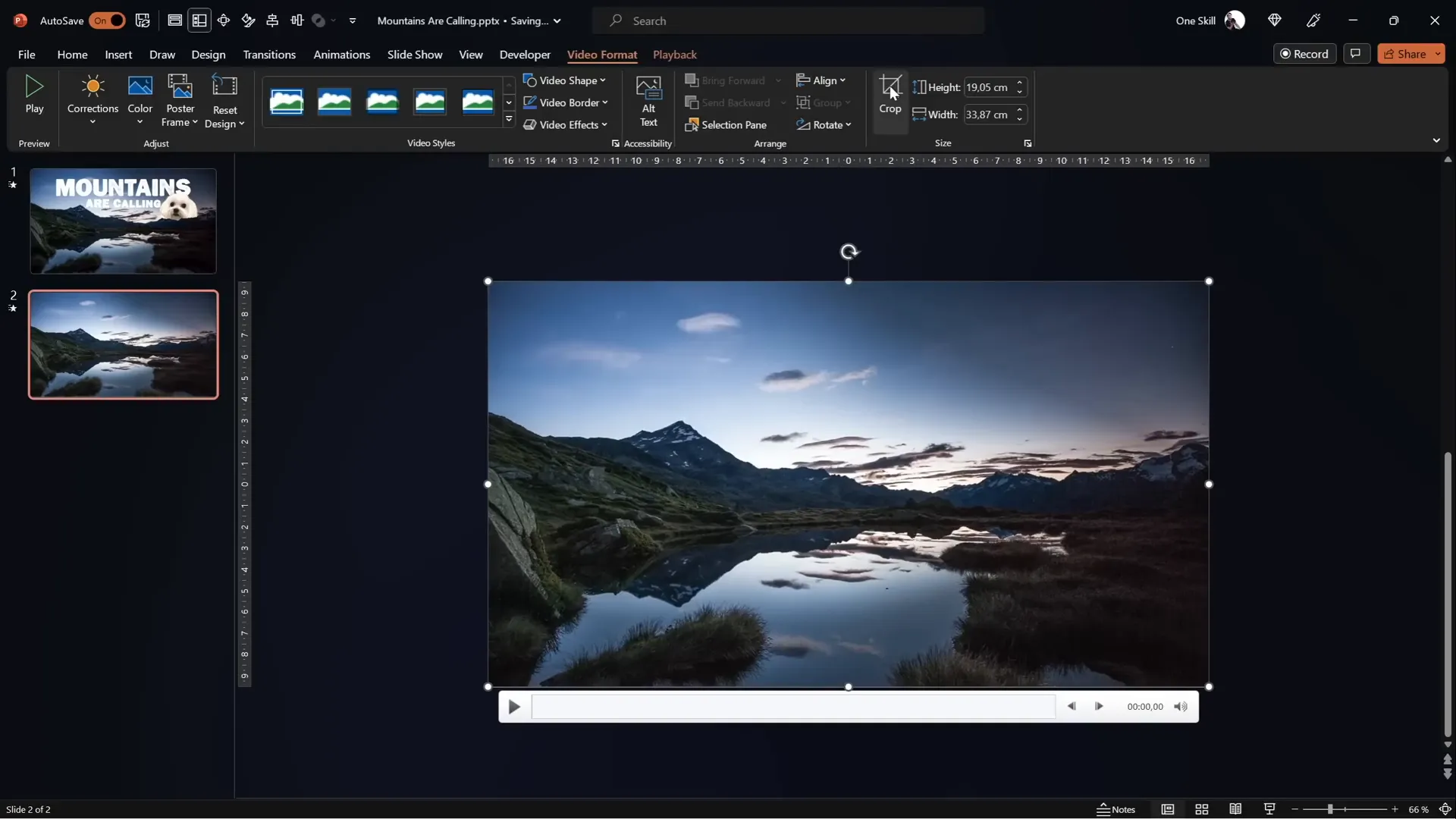 PowerPoint slide with full screen video of mountains and sky